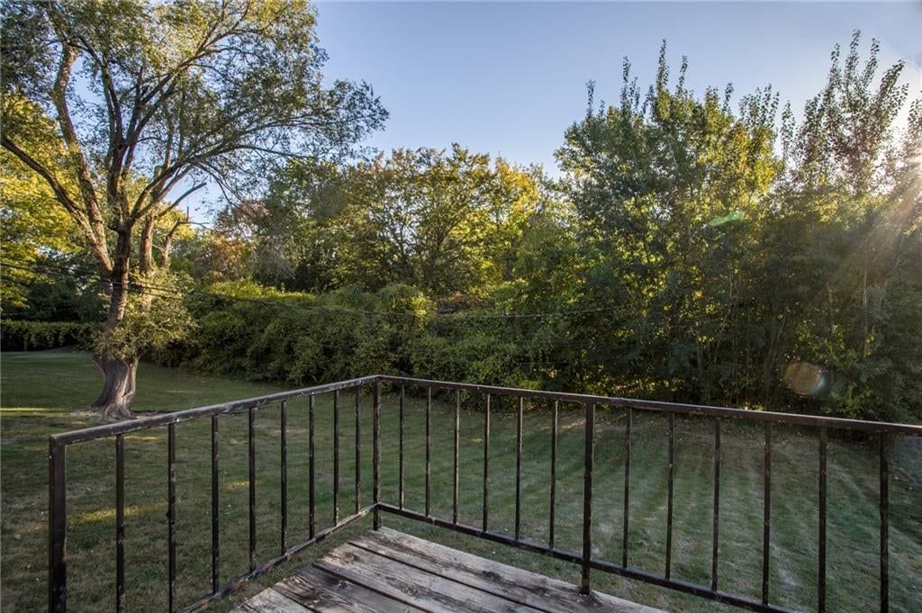 Mature trees at 607 NE Lynn Street, Lee's Summit, MO 64063