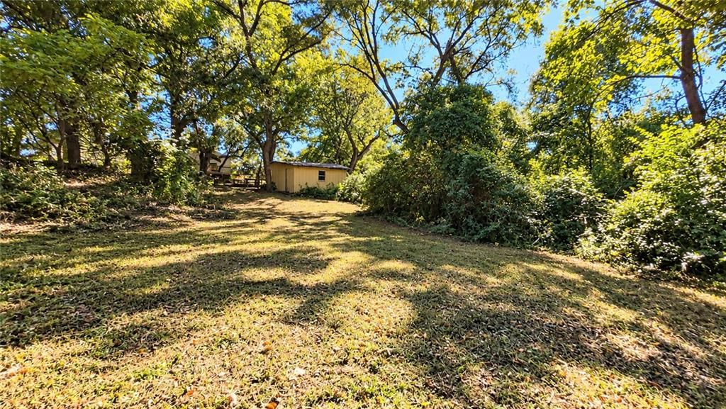 Big backyard, mature trees and flat lot at 1820 S 22nd Street, Kansas City, KS 66106