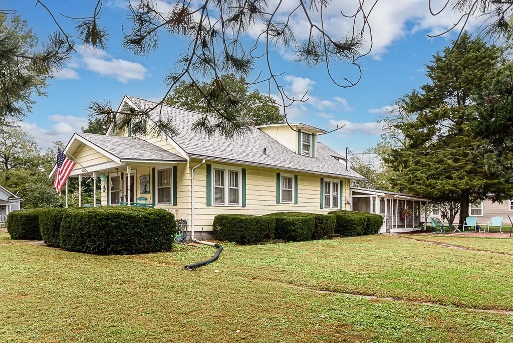 Screened porch and concrete patio at 15552 Ripley Street, Basehor, KS 66007