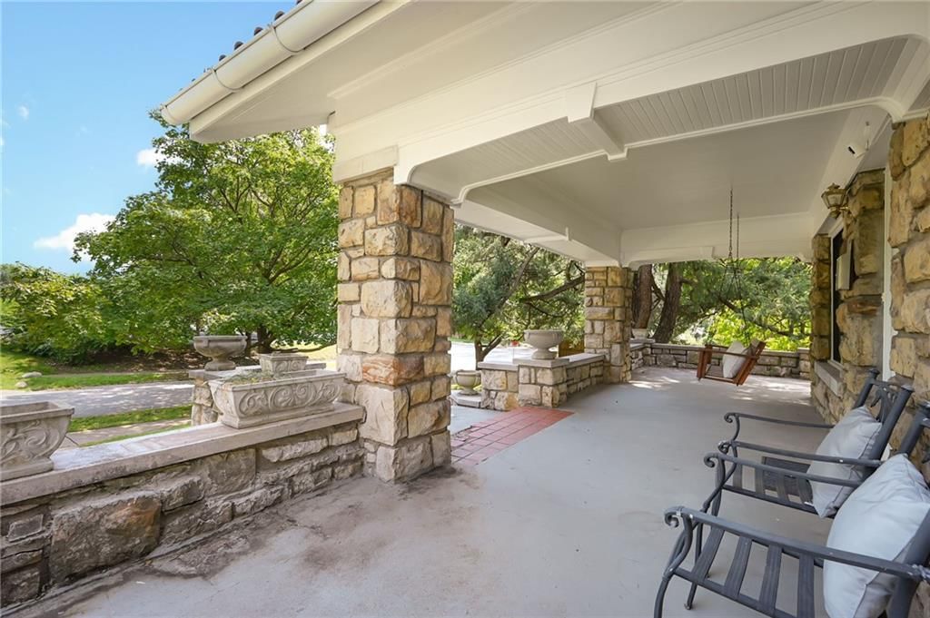 Covered front porch and covered patio at 7444 Mercier Street, Kansas City, MO 64114