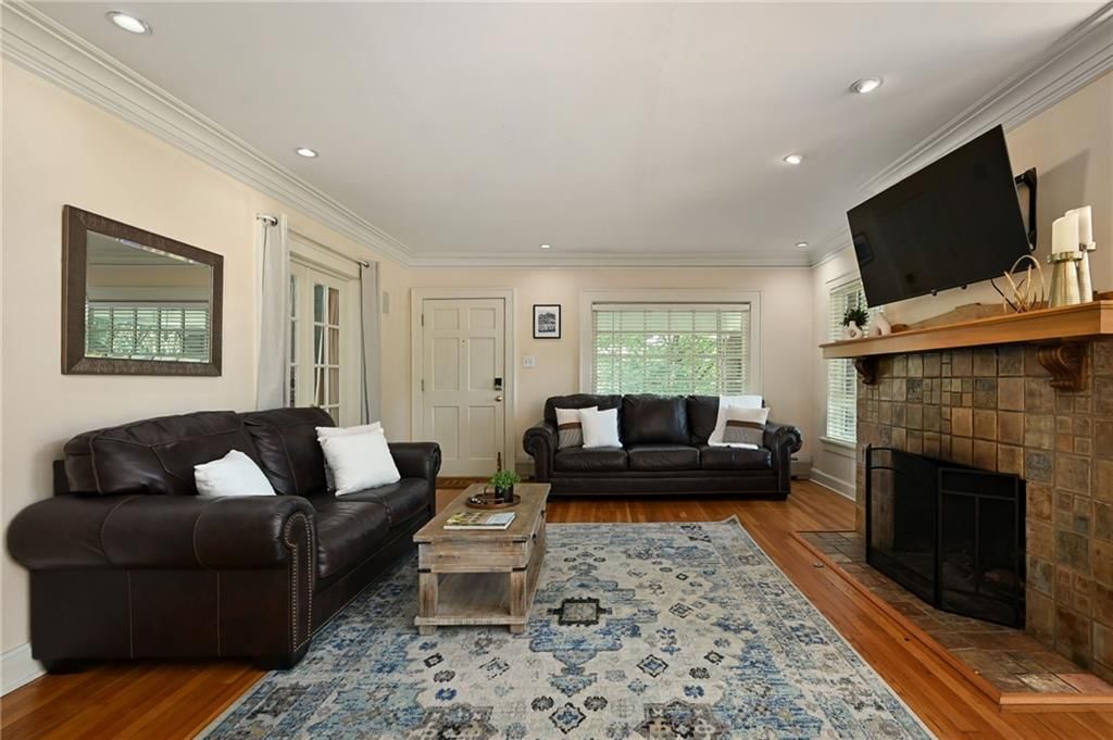 Open floor plan, hardwood floors and recessed lighting at 7444 Mercier Street, Kansas City, MO 64114