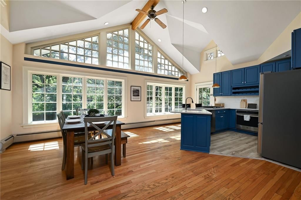 Tall ceilings, ceiling beams and wall of windows at 7444 Mercier Street, Kansas City, MO 64114
