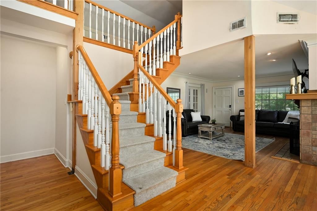 Staircase and wood stair railing at 7444 Mercier Street, Kansas City, MO 64114