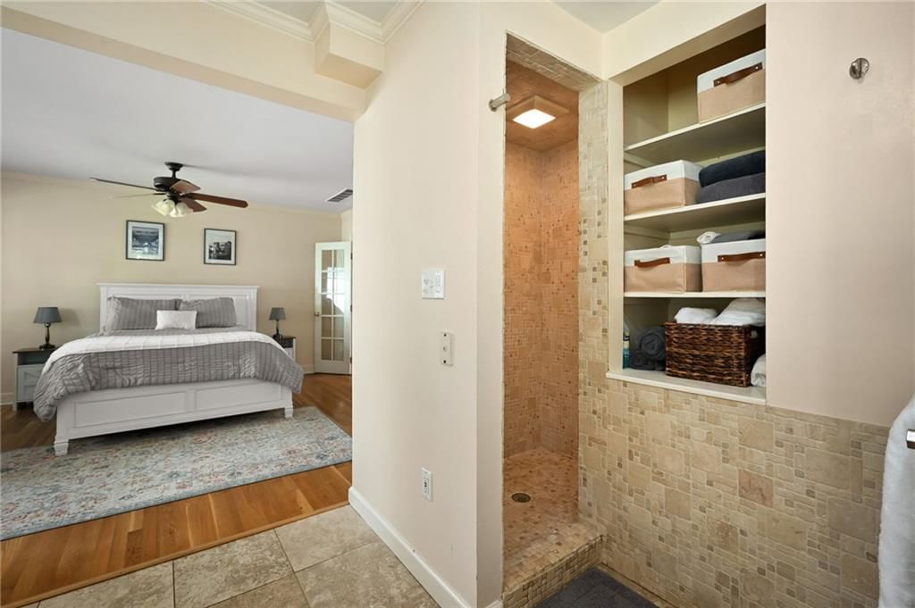 Walk-in shower and tiled shower at 7444 Mercier Street, Kansas City, MO 64114