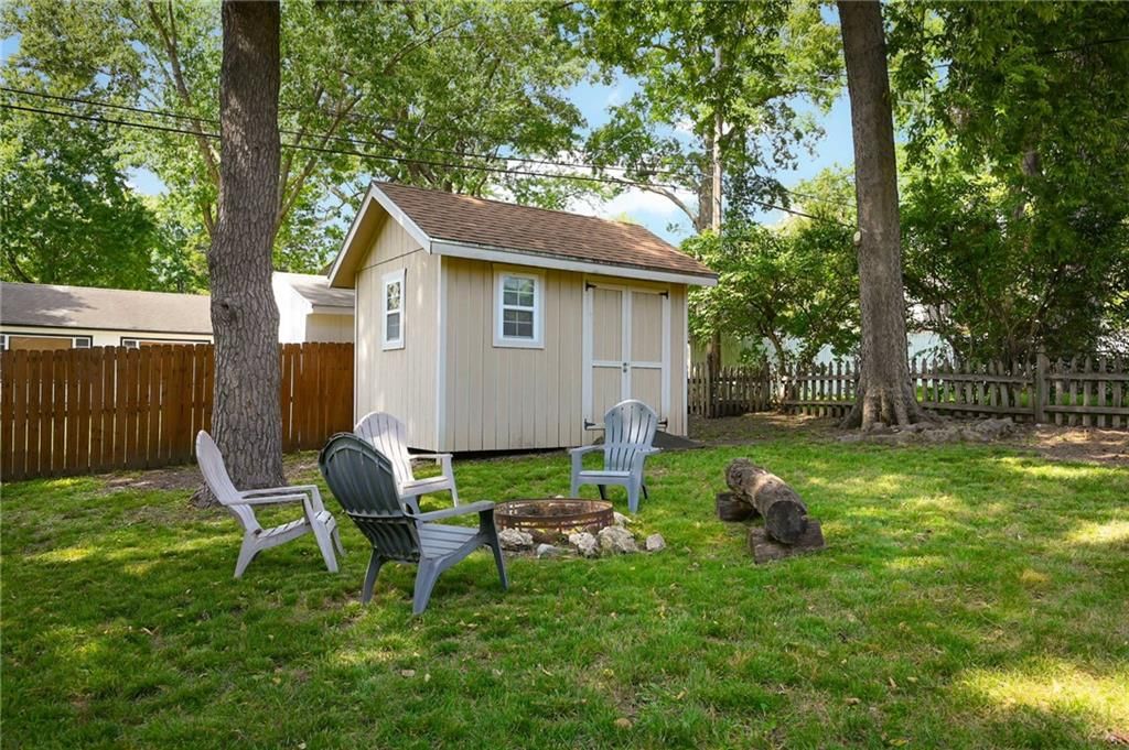 Fenced yard, fire pit and wood fence at 7444 Mercier Street, Kansas City, MO 64114