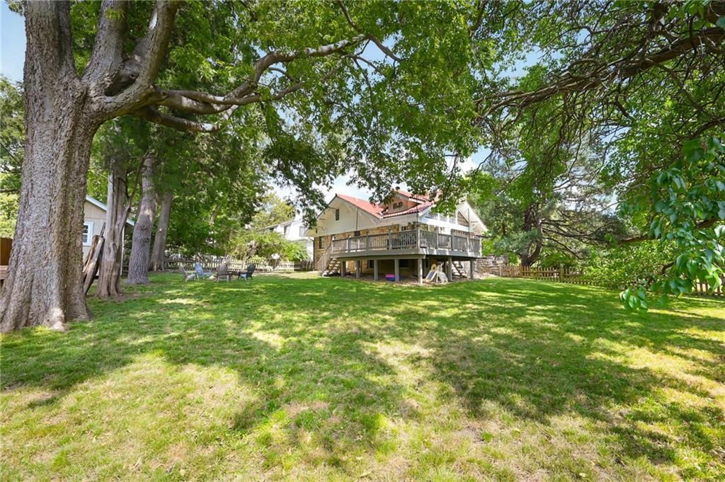 Big backyard, mature trees and flat lot at 7444 Mercier Street, Kansas City, MO 64114