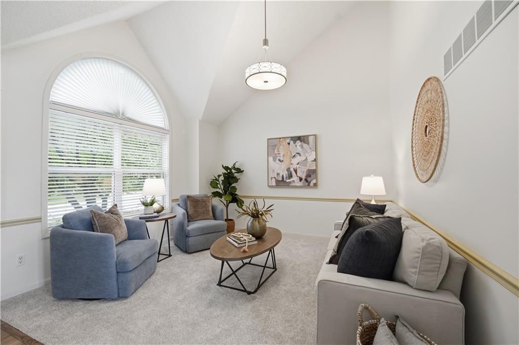 Tall ceilings and statement lighting at 18470 W 161ST Street, Olathe, KS 66062