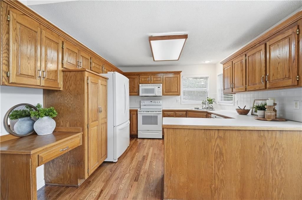 Kitchen island and kitchen backsplash at 18470 W 161ST Street, Olathe, KS 66062