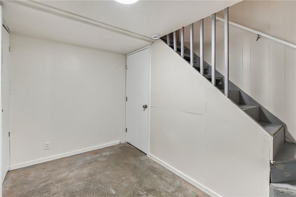 Staircase and iron stair railing at 5901 N Michigan Place, Gladstone, MO 64118