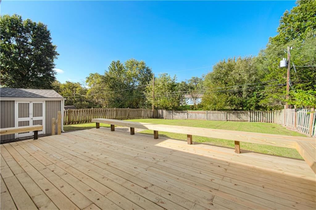 Deck, big backyard and fenced yard at 10006 Benson Street, Overland Park, KS 66212