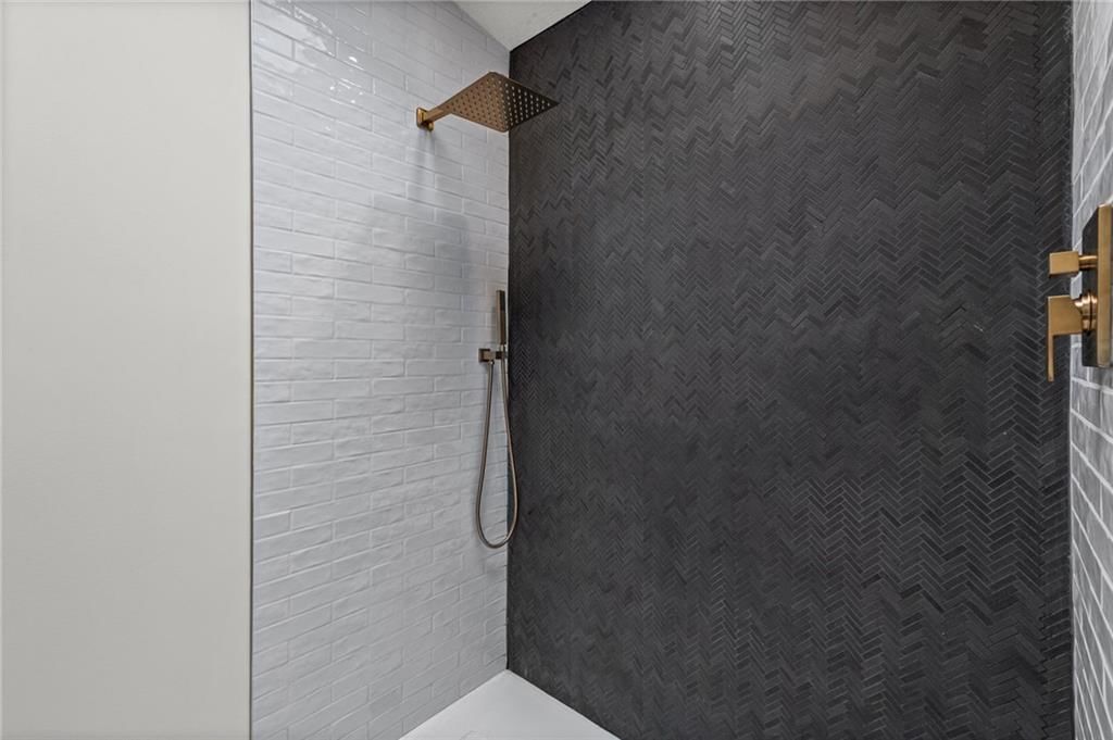 Walk-in shower, tiled shower and double vanity at 8108 E 92nd Terrace, Kansas City, MO 64138