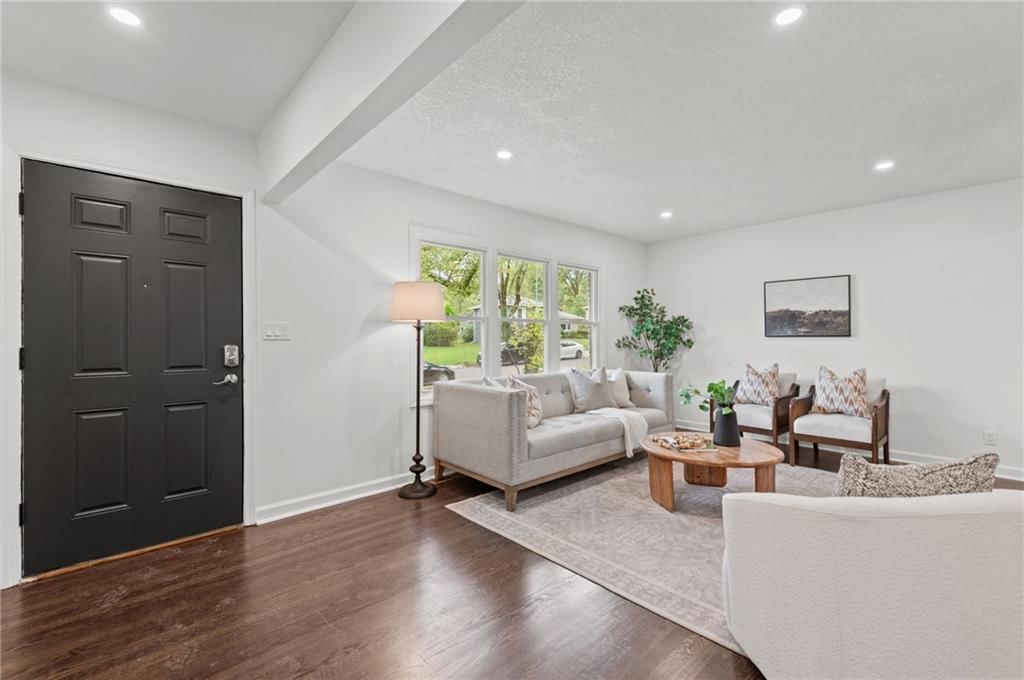 Hardwood floors, recessed lighting and white trim at 8108 E 92nd Terrace, Kansas City, MO 64138