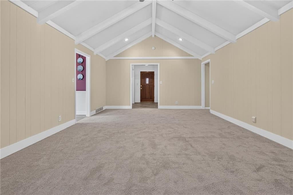 Tall ceilings, shiplap / paneling and ceiling beams at 19475 Hardy Street, Overland Park, KS 66085