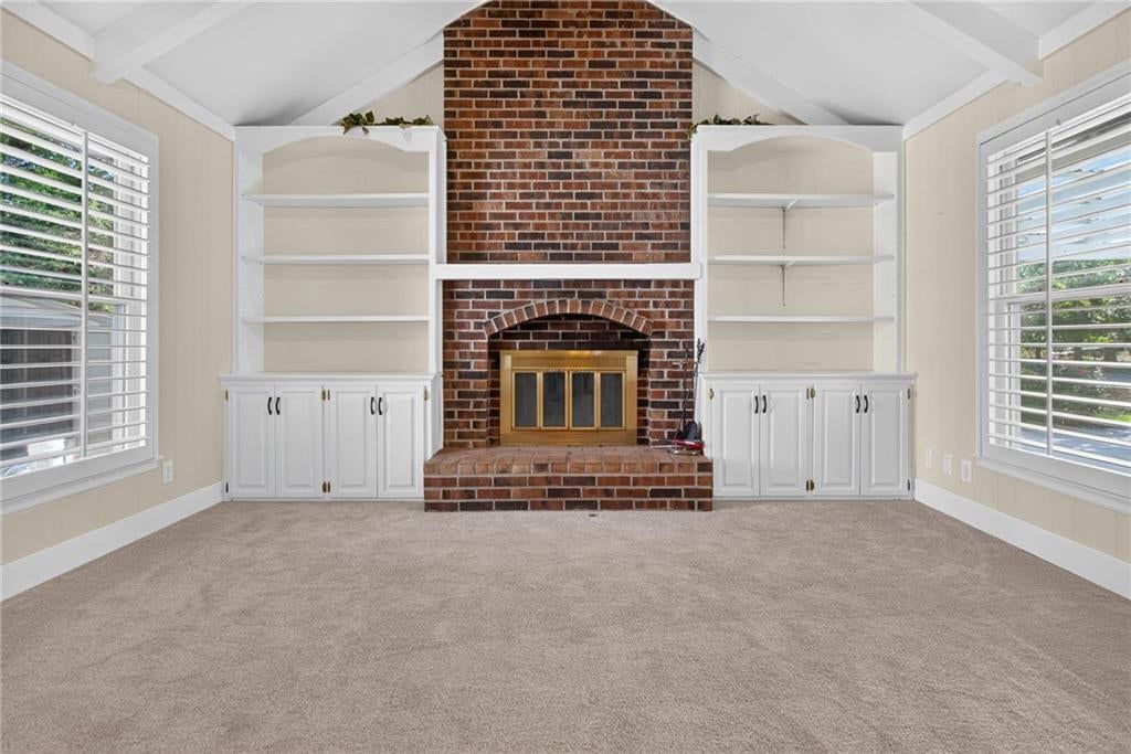 Fireplace and exposed brick wall at 19475 Hardy Street, Overland Park, KS 66085