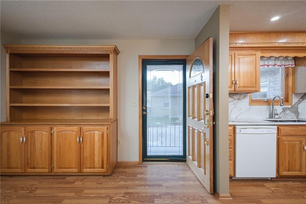 Hardwood floors and beige walls at 116 Sibley Street, Buckner, MO 64016