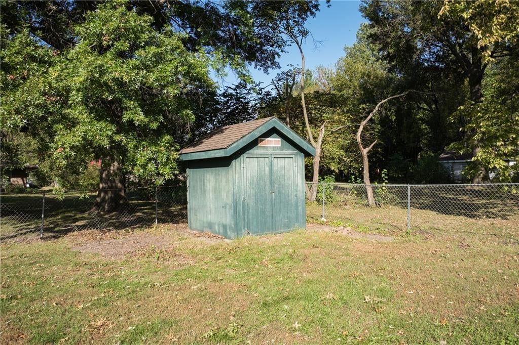 Fenced yard and chain-link fence at 116 Sibley Street, Buckner, MO 64016