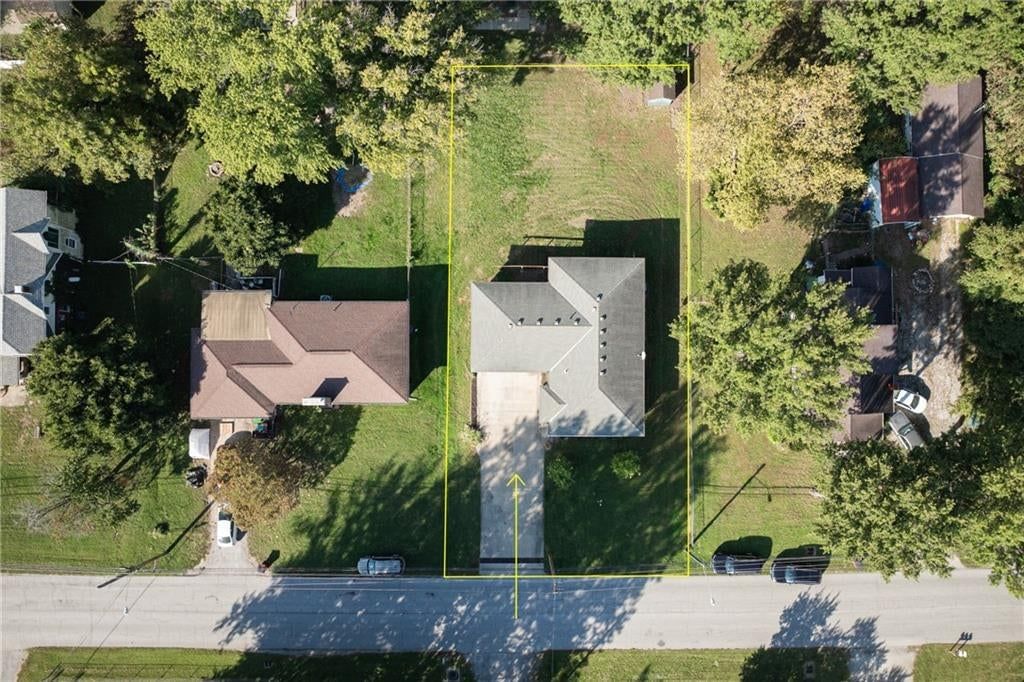 Big backyard, mature trees and flat lot at 116 Sibley Street, Buckner, MO 64016