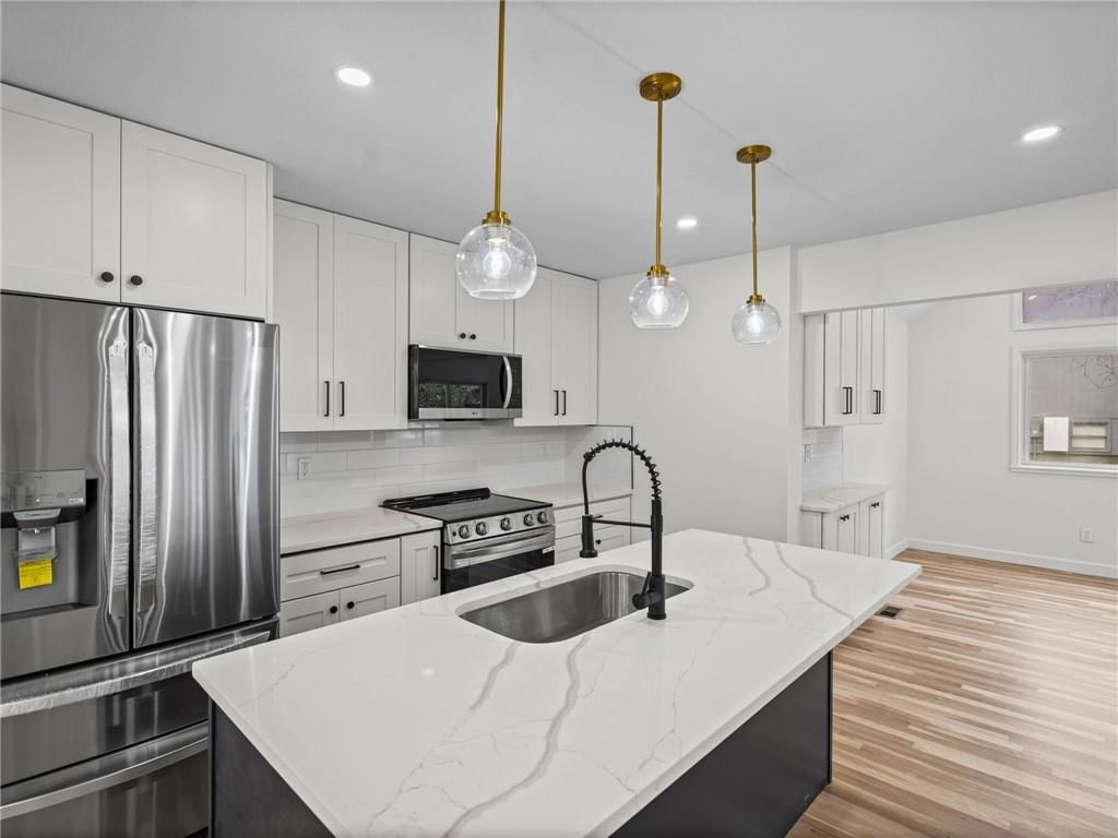 Photo 18: white kitchen cabinets, 8206 Alden Street, Lenexa, KS 66215