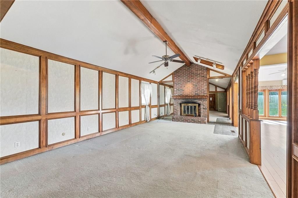 Fireplace and ceiling beams at 5905 E 210th Street, Belton, MO 64012