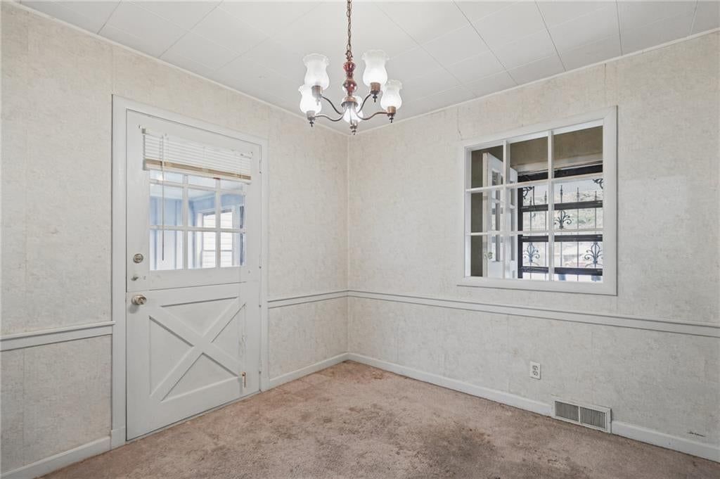 Chandelier and wainscoting or board and batten at 8932 E 66th Street, Raytown, MO 64133