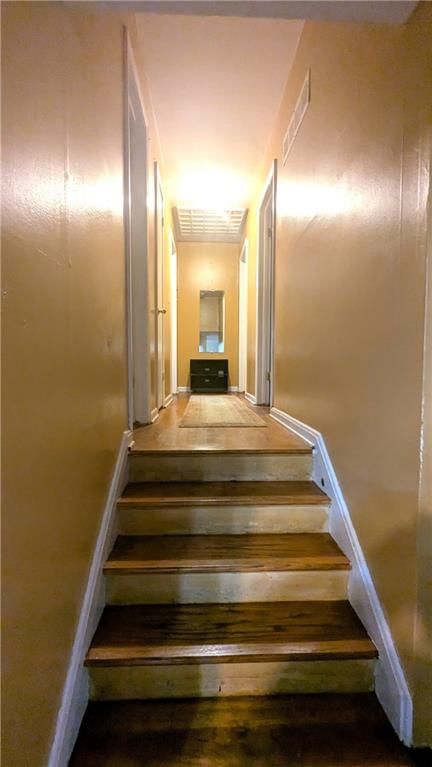 Staircase and wood stair railing at 8507 Spring Valley Road, Raytown, MO 64138
