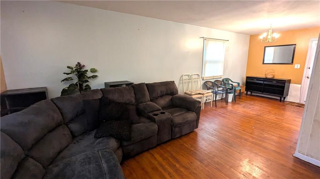 Hardwood floors and white trim at 8507 Spring Valley Road, Raytown, MO 64138