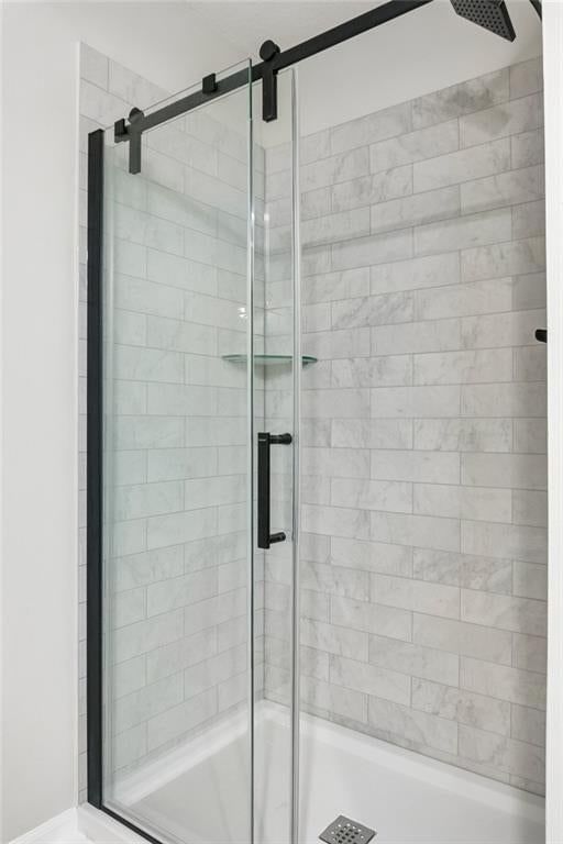 Walk-in shower, tiled shower and frameless glass shower at 7606 NW 73rd Court, Kansas City, MO 64152