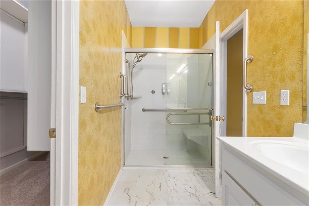 Walk-in shower, tiled shower and frameless glass shower at 12133 S Valley Road, Olathe, KS 66061