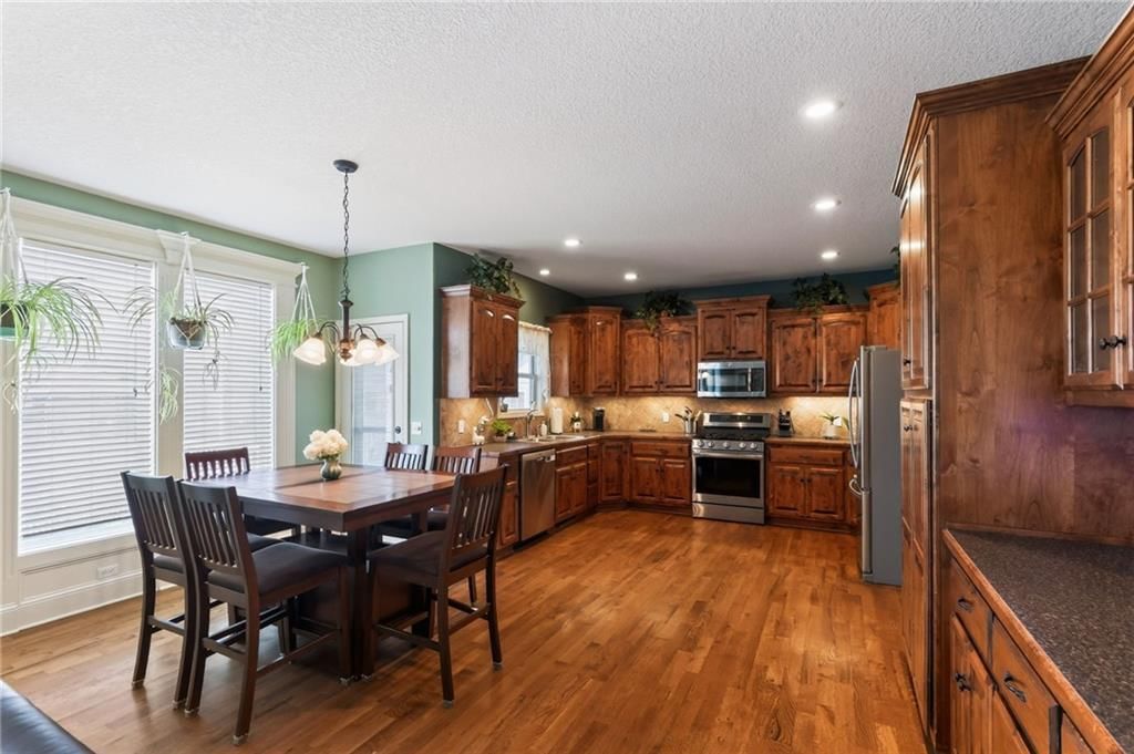 Breakfast nook, kitchen backsplash and recessed lighting at 406 Buck Court, Kearney, MO 64060