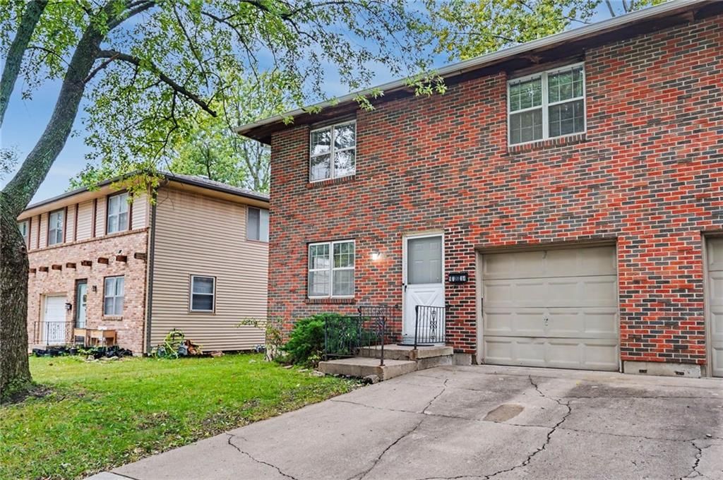 Brick exterior and attached garage at 9734 Hadley Drive, Overland Park, KS 66212
