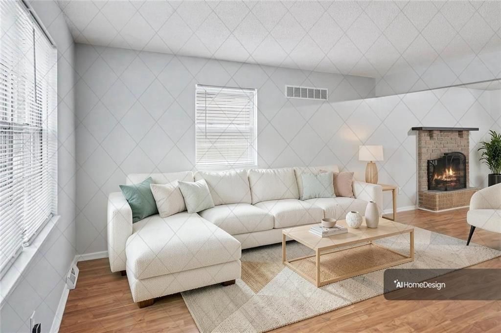 Fireplace and open floor plan at 9734 Hadley Drive, Overland Park, KS 66212