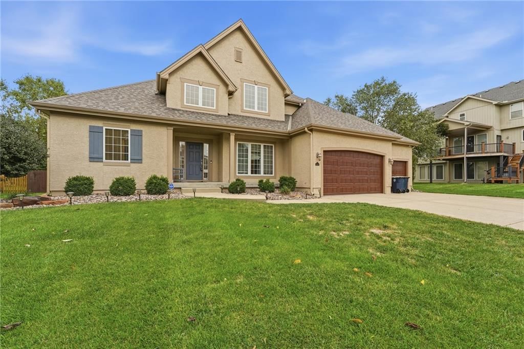 Garage for three or more cars, covered front porch and corner lot at 10303 N Dallas Avenue, Kansas City, MO 64154