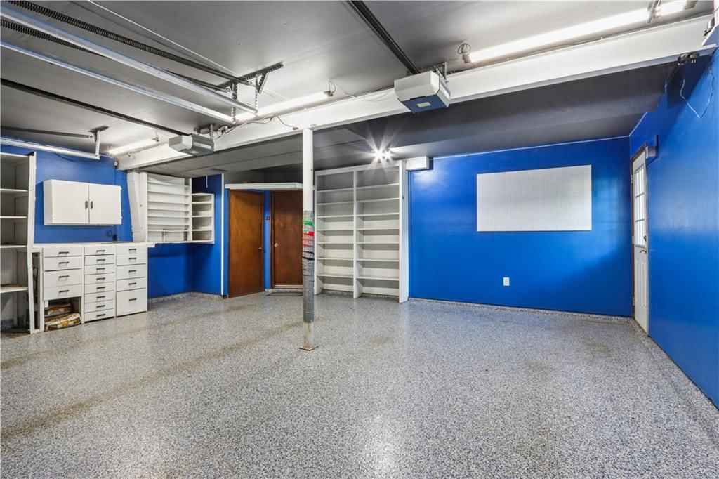 Garage storage system and epoxy garage floor at 9532 Benson Street, Overland Park, KS 66212