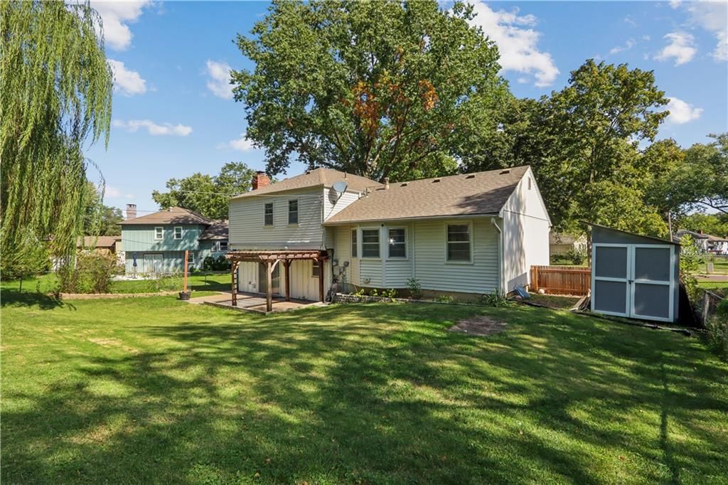 Big backyard and mature trees at 9532 Benson Street, Overland Park, KS 66212