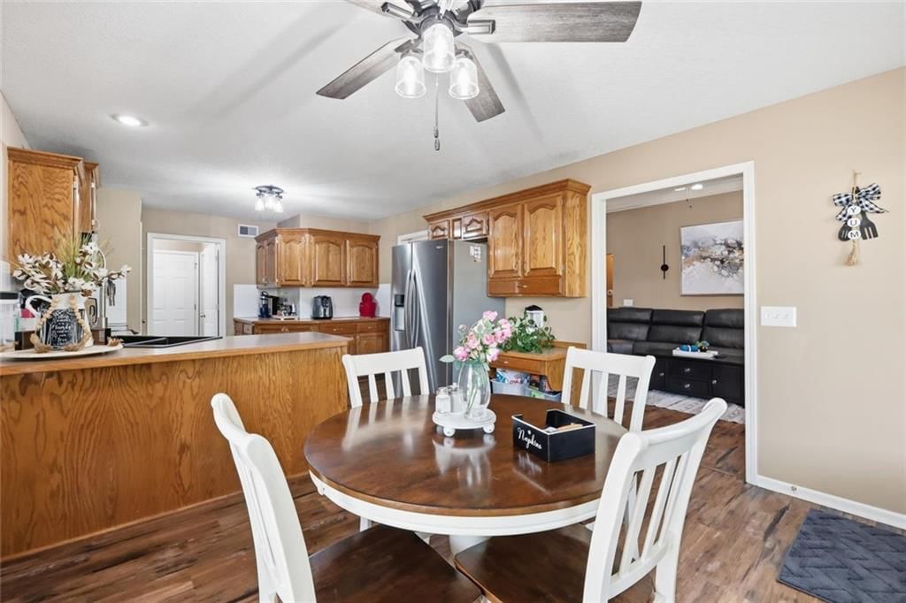 Stainless steel appliances, wood kitchen cabinets and electric range at 11226 N Belleview Avenue, Kansas City, MO 64155
