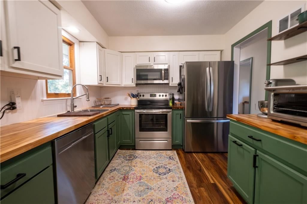 Stainless steel appliances and electric range at 1152 NE 84th Terrace, Kansas City, MO 64155