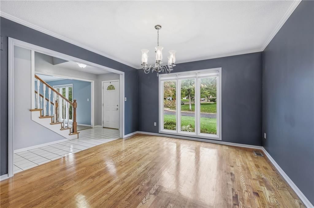 Hardwood floors and statement lighting at 14933 W 82nd Terrace, Lenexa, KS 66215