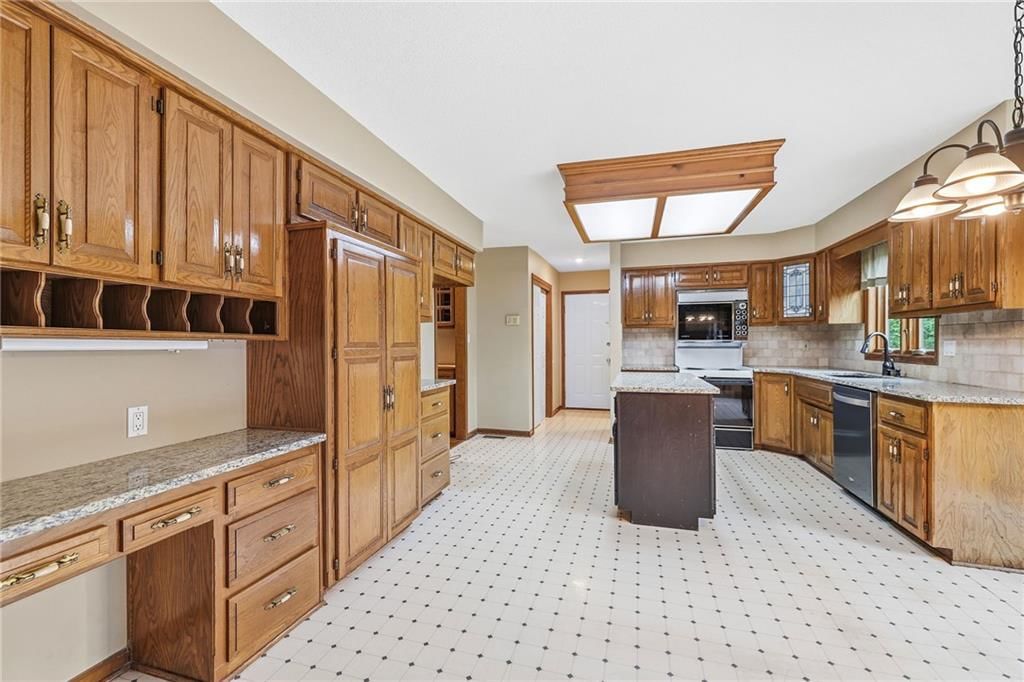 Kitchen island and kitchen backsplash at 14933 W 82nd Terrace, Lenexa, KS 66215