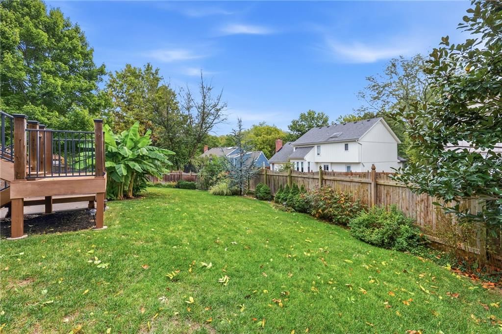 Big backyard, fenced yard and mature trees at 14933 W 82nd Terrace, Lenexa, KS 66215