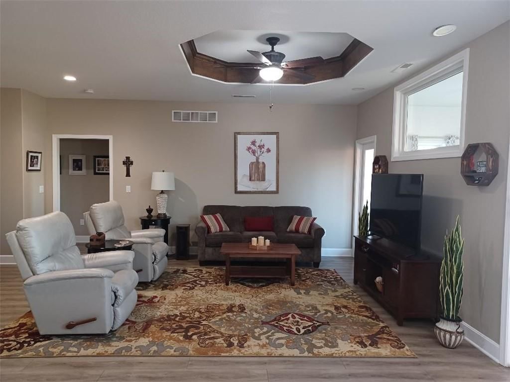 Open floor plan, tray ceiling and white trim at 916 Cedar Court, Paola, KS 66071