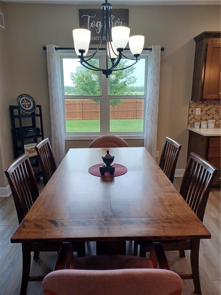 Statement lighting and breakfast nook at 916 Cedar Court, Paola, KS 66071