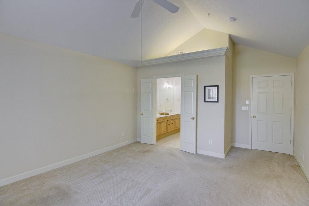 Main-floor primary bedroom at 7101 Meadowsweet Lane, Shawnee, KS 66227