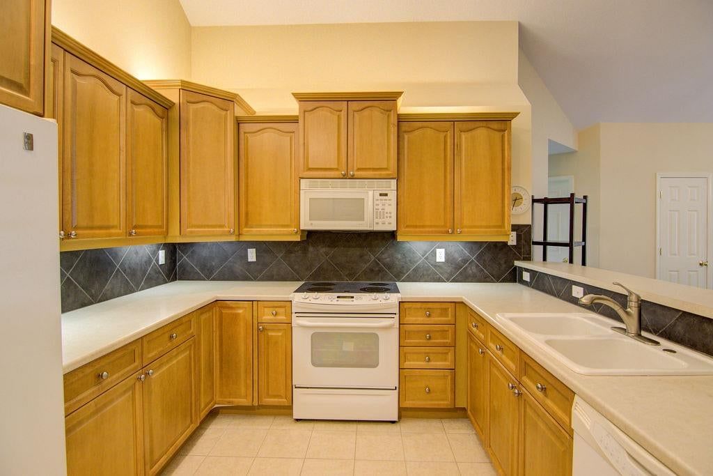 Tile floors and electric range at 7101 Meadowsweet Lane, Shawnee, KS 66227