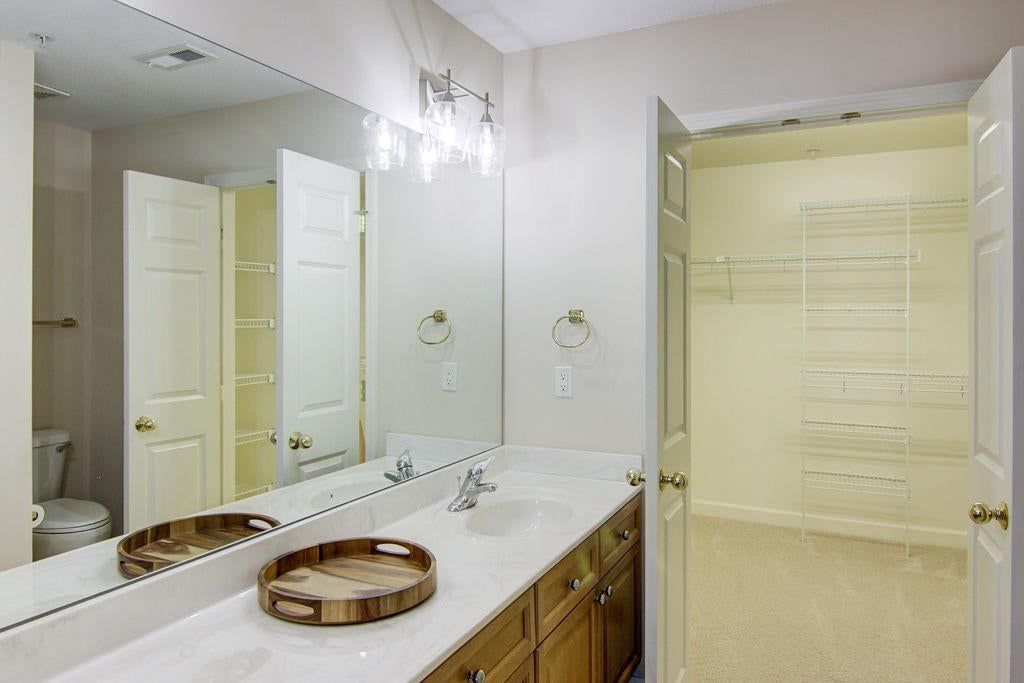 Double vanity and wood vanity at 7101 Meadowsweet Lane, Shawnee, KS 66227