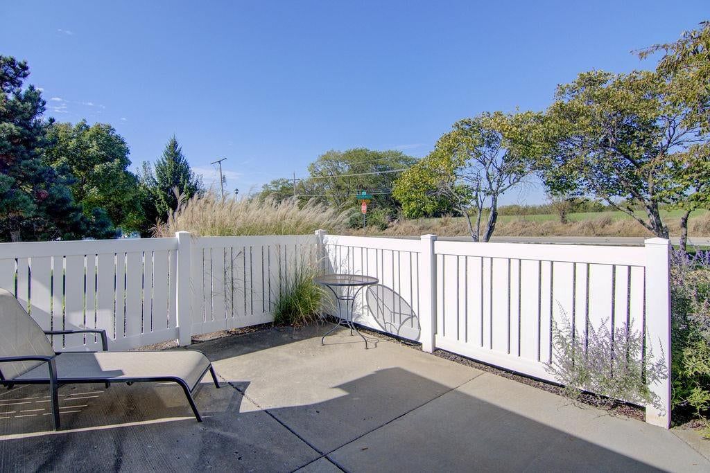 Fenced yard, vinyl fence and concrete patio at 7101 Meadowsweet Lane, Shawnee, KS 66227