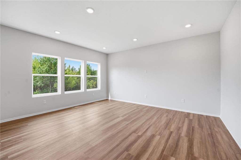 Luxury vinyl floors and recessed lighting at 1601 SW 10th Terrace, Oak Grove, MO 64075