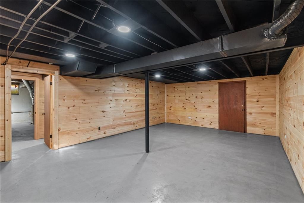 Finished basement, recessed lighting and staircase at 4311 Yecker Avenue, Kansas City, KS 66104
