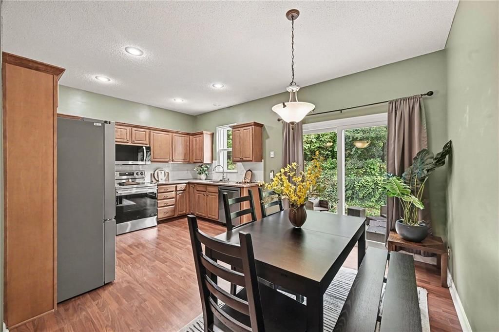 Stainless steel appliances, breakfast nook and recessed lighting at 7313 McCoy Street, Shawnee, KS 66227