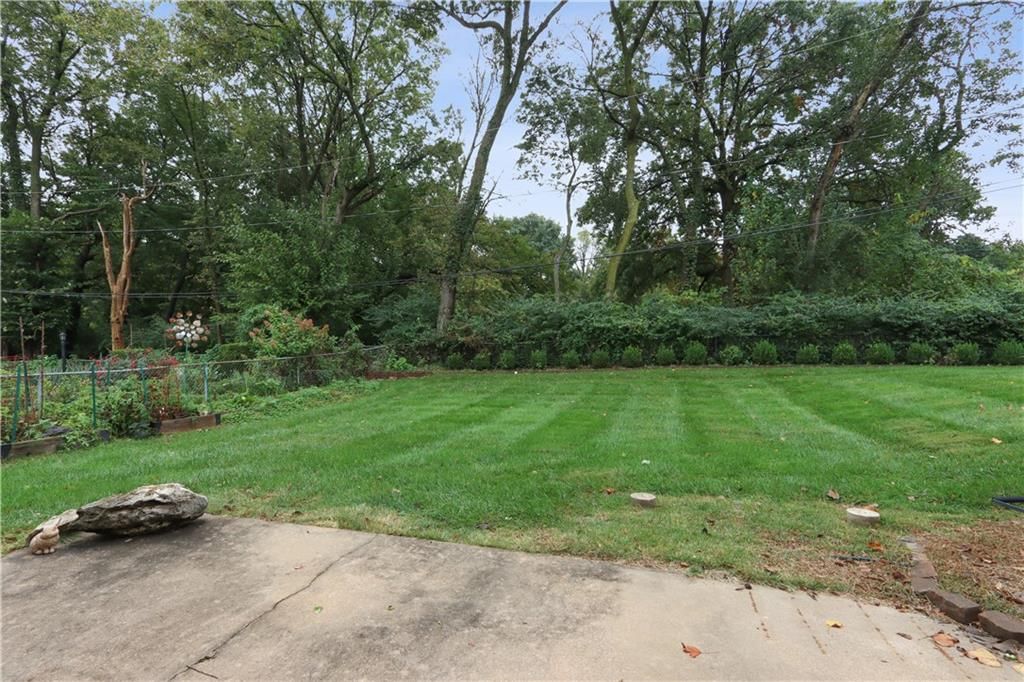 Big backyard, mature trees and flat lot at 4107 E 107th Terrace, Kansas City, MO 64137