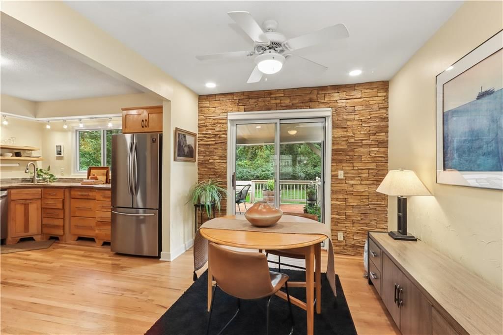 Open floor plan, breakfast nook and recessed lighting at 4107 E 107th Terrace, Kansas City, MO 64137